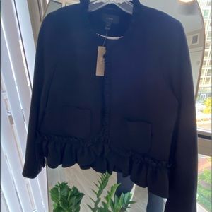 Black blazer from J. Crew with ruffled detailing on hem and neck. Size 10.